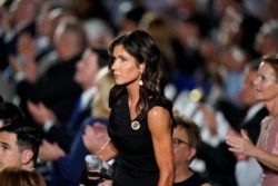 FILE - South Dakota Gov. Kristi Noem stands on the White House lawn during the Republican National Convention in Washington, Aug. 27, 2020. On Sept. 11, North and South Dakota had led the country in new COVID cases per capita over the past two weeks.