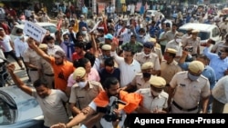 Police stand guard to secure the site of Muslim Friday prayers amid protests by Hindu right-wing groups, in Gurgaon, India, Oct. 29, 2021.