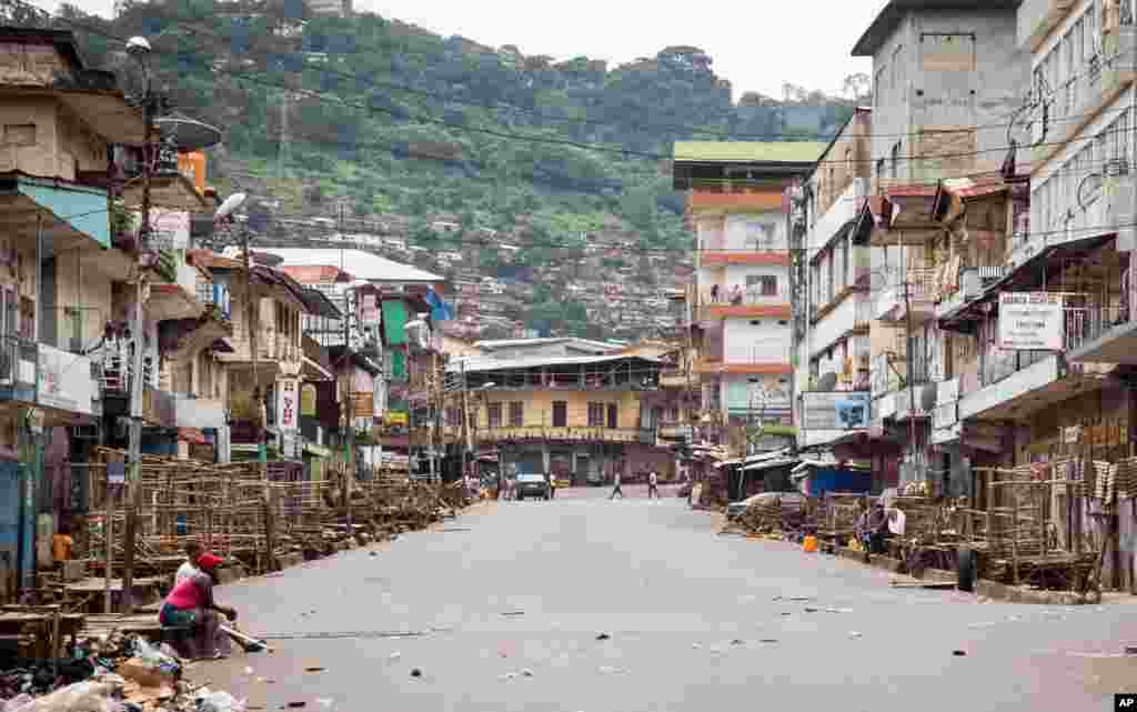 Few people are seen on the streets during a three-day lockdown to prevent the spread of the Ebola virus, in Freetown, Sierra Leone, Sept. 21, 2014.