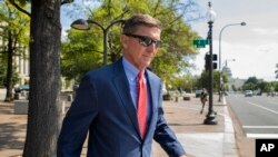 FILE - In this Sept. 10, 2019, photo, Michael Flynn, President Donald Trump's former national security adviser, leaves the federal court in Washington. 
