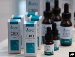 Bottles of extracted cannabis oil are displayed during a press conference at Thailand's Health Ministry in Bangkok, Thailand, Wednesday, Aug. 7, 2019. The Health Ministry received its first batch of legal medical marijuana to be distributed in state…