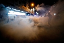 A man is seen after riot police fired tear gas after a sit-in at Yuen Long to protest against violence two months ago when white-shirted men wielding pipes and clubs wounded anti-government protesters and passers-by, in Hong Kong, Sept. 21, 2019.