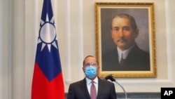 U.S. Health and Human Services Secretary Alex Azar speaks during a meeting with Taiwan's President Tsai Ing-wen, unseen, in front of a portrait of Sun Yat-sen, who is widely regarded as the founding father of modern China, in Taipei, Taiwan, Monday,…