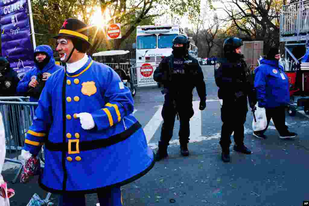 Police take a position along the route before the start of the 92nd annual Macy's Thanksgiving Day Parade in New York, Nov. 22, 2018.