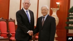 U.S. Secretary of Defense Jim Mattis, left, shakes hands with Vietnam's Communist Party General Secretary Nguyen Phu Trong before holding talks in Hanoi, Vietnam, Jan. 25, 2018.