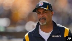 FILE - Pittsburgh Steelers assistant coach Teryl Austin watches the team warm up before an NFL football game against the Cincinnati Bengals, Sept. 26, 2021, in Pittsburgh.