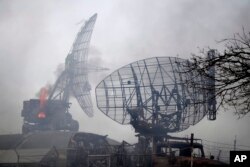 Ukrainaning Mariupol shahridagi harbiy inshoot vayron qilingan, 24-fevral, 2022