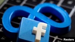 3D-printed images of logos of Facebook parent Meta Platforms and of Facebook are seen on a laptop keyboard in this illustration taken on November 2, 2021. (REUTERS/Dado Ruvic/Illustration)