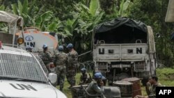 FILE - Wanajeshi walinda amani wakiwa katika kituo kipya cha kijeshi huko Rugari, kilomita 50 kutoka mji wa Goma mashariki ya Jamhuri ya Kidemokrasia ya Congo, Jan. 28, 2022.(Photo by Glody MURHABAZI / AFP)