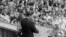 U.S. President John F. Kennedy, standing on a rostrum, addresses a large crowd in the main square in front of Schoeneberg City Hall in West Berlin, Germany, June 26, 1963. 
