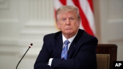 President Donald Trump listens during a "National Dialogue on Safely Reopening America's Schools," event in the East Room of the White House, Tuesday, July 7, 2020, in Washington. (AP Photo/Alex Brandon)