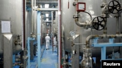 FILE - A technician is seen at the uranium conversion facility in Isfahan, 450 kilometers south of Tehran, Iran, Feb. 3, 2007. 