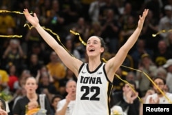 FILE - Caitlin Clark (22) reacts after the game against Ohio State. Clark broke the NCAA basketball all-time scoring record during the second quarter. (Jeffrey Becker-USA TODAY Sports)