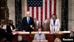 Vice President Mike Pence and House Speaker Nancy Pelosi resume presiding over a Joint session of Congress to certify the 2020 Electoral College results, after supporters of President Donald Trump stormed the Capitol earlier in the day, on Capitol Hill in Washington, U.S. January