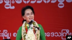 FILE - Myanmar's opposition leader Aung San Suu Kyi speaks during an election campaign for her National League for Democracy party, Sept 27, 2015.