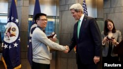 Displaced Iraqi children stand in line to receive food rations in Mosul's western Tal al-Rumman neighborhood, during an offensive to retake the western parts of the city from the jihadists.