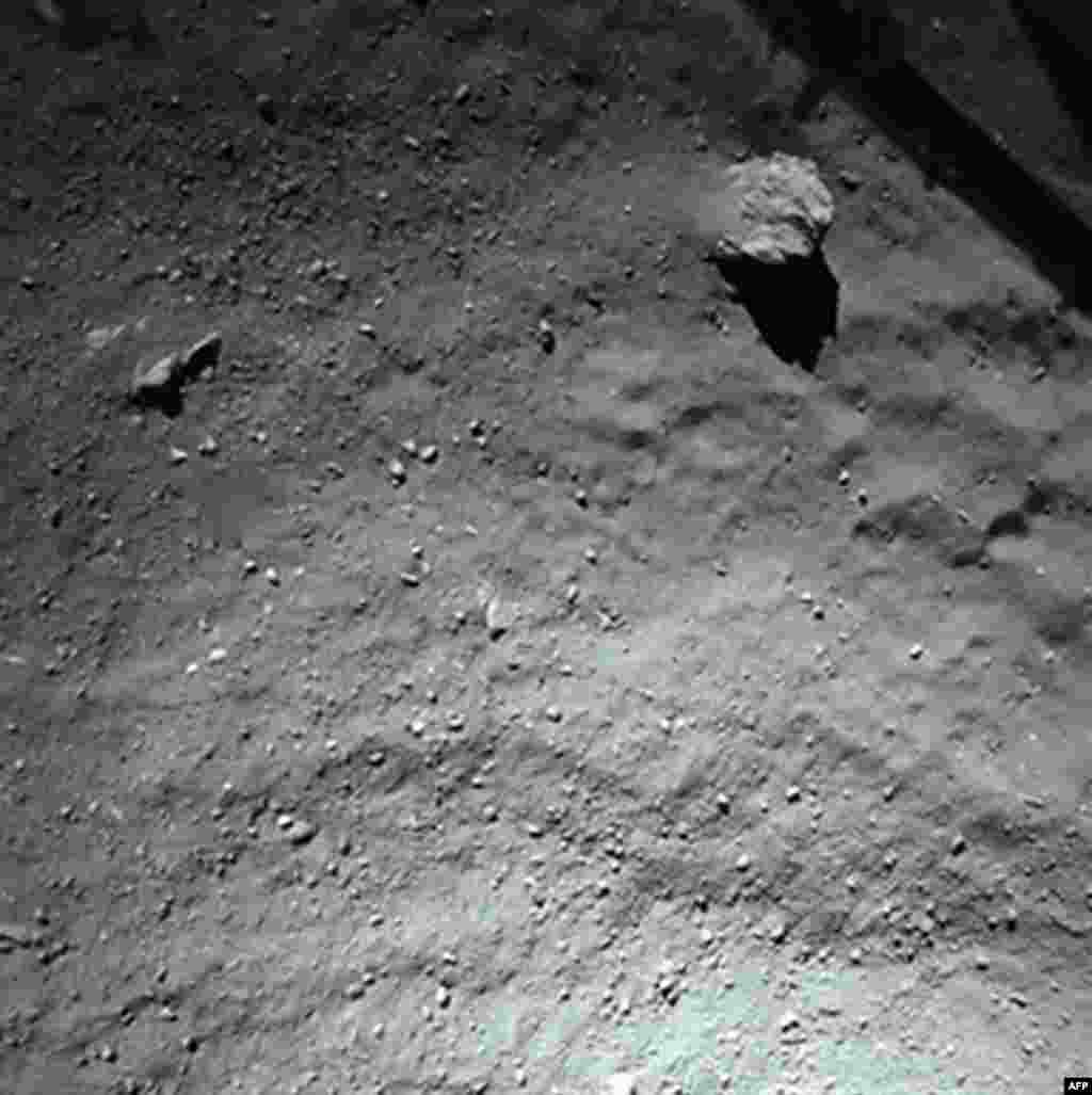 A handout photo released on November 13, 2014 by the European Space Agency, and taken by the Rosetta Lander Imaging System instrument, shows the surface of comet 67P/Churyumov-Gerasimenko during Philae's descent, from a distance of approximately 40 meters above the surface. (Courtesy: European Space Agency)