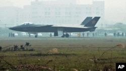 An aircraft that is reported to be a Chinese stealth fighter is seen in Chengdu, Sichuan province, in this picture released by Kyodo news agency on 8 Jan 2011.