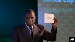 FILE - President of the Confederation of African Football, Issa Hayatou, announces that Gabon will be hosting the 2017 African Cup of Nations, April 8, 2015.