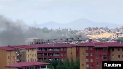 Moshi waonekana kwa mbali mjini Addis Ababa, Ethiopia, wakati wa ghasia na maandamano kufuatia kuuawa kwa mwanamuziki maarufu Haacaaluu Hundeessaa.