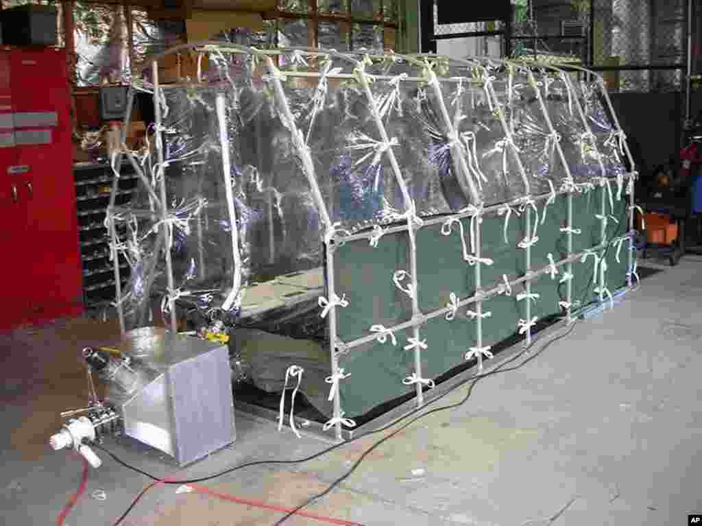 Center for Disease Control photo showing an Aeromedical Biological Containment System which looks like a sealed isolation tent intended for Ebola air transportation, July 31, 2014.