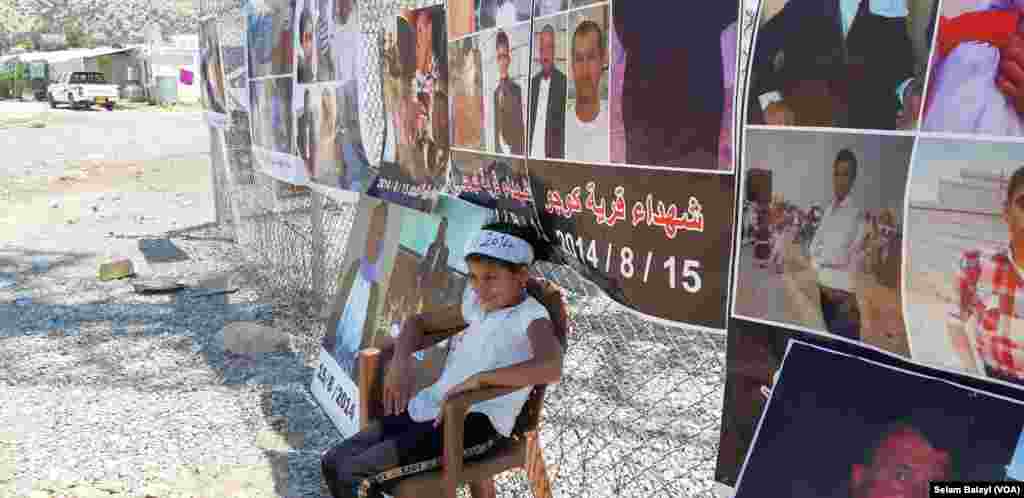 Wêneyên zarok û qurbaniyên qetlîama gundê Koço li kampa Qaidiya bîranaîna 6ê ya komkujiya gundê koço