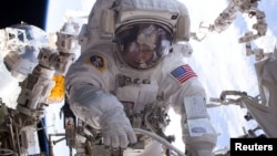 NASA astronaut Peggy Whitson is seen during a spacewalk outside the International Space Station. Whitson is to return to Earth Saturday as the American astronaut with the most time in space, 665 days.