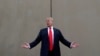 FILE - President Donald Trump speaks during a tour as he reviews border wall prototypes in San Diego, California, March 13, 2018.