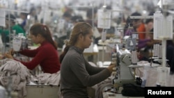 Employees work at a factory supplier of the H&M brand in Kandal province, Cambodia, December 12, 2018.