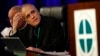 Cardinal Daniel DiNardo of the Archdiocese of Galveston-Houston, president of the United States Conference of Catholic Bishops, prepares to lead the USCCB's annual fall meeting, Nov. 12, 2018, in Baltimore, Maryland. 