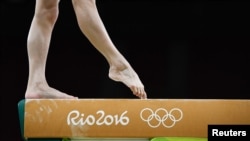 FILE - A member of China's women's gymnastics team is ready to stay on her toes in the 2016 Rio Olympics. (REUTERS/Dylan Martinez)