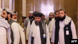 Anggota delegasi Taliban terlihat pada akhir pembicaraan damai antara pemerintah Afghanistan dan Taliban, di Doha, Qatar, 18 Juli 2021. (Foto: AFP)