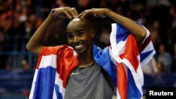 FILE - Britain's Mo Farah celebrates winning the Men's 5000m Action at the Birmingham Indoor Grand Prix, Barclaycard Arena, Feb. 18, 2017. 