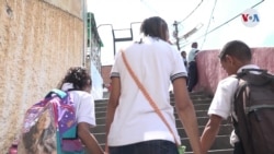 Venezuela: Niños dejados atrás por la migración experimentan depresión y rabia