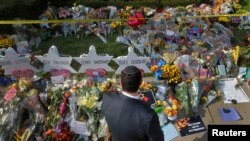A man prays at a makeshift memorial outside the Tree of Life synagogue following Saturday's shooting at the synagogue in Pittsburgh, Pennsylvania, Oct. 31, 2018. 