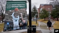 A student walks near the Alumni Gymnasium on the campus of Dartmouth College, Tuesday, March 5, 2024, in Hanover, N.H. (AP Photo/Robert F. Bukaty)