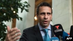 FILE - Venezuelan opposition leader Henrique Capriles speaks to reporters at OAS headquarters in Washington, D.C., March 31, 2017. 