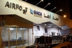 A broken sign is seen at the entrance of Abha airport in the popular mountain resort of Abha in the southwest of Saudi Arabia on August 31, 2021.