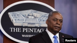 FILE - U.S. Defense Secretary Lloyd Austin speaks to Defense Department personnel at the Pentagon in Arlington, Virginia, Feb. 10, 2021..