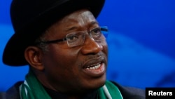 People wave a second Spanish Republic flag (C) and Communist flags during a May Day rally in Malaga, Spain. International Workers' Day, also known as Labor Day or May Day, commemorates the struggle of workers in industrialized countries in the 19th century for better working conditions.