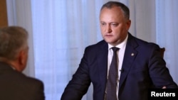 People light candles inside Our Lady of Aparecida Basilica, the temple of Brazil&rsquo;s patron saint, in Aparecida.
