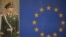 FILE - A Chinese paramilitary policeman stands guard outside the European Union Delegation in Beijing, Nov. 1, 2011.