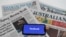 An illustration image shows a phone screen with the "Facebook" logo and Australian newspapers in Canberra, Australia, Feb. 18, 2021. 
