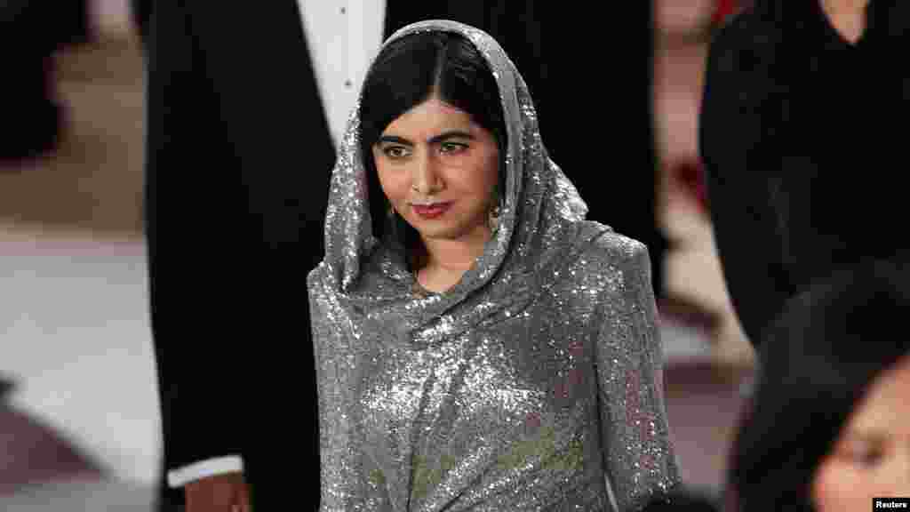 Malala Yousafzai walks the champagne-colored red carpet during the Oscars arrivals at the 95th Academy Awards in Los Angeles, March 12, 2023. (Photo by Aude Guerrucci/Reuters)