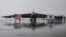 National flags of the US and South Korea are displayed in front of a B-52H strategic bomber parked at a South Korean Air Force base at Cheongju Airport on Oct. 19, 2023.