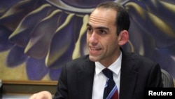 Cypriot Finance Minister Harris Georgiades speaks to Reuters in an interview in Nicosia, Cyprus, April 22, 2013.