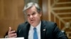 El director del FBI, Christopher Wray, testifica ante una audiencia del Congreso para discutir las amenazas a la seguridad 20 años después de los ataques terroristas del 11 de septiembre, el 21 de septiembre de 2021 en Capitolio en Washington.