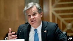 El director del FBI, Christopher Wray, testifica ante una audiencia del Congreso para discutir las amenazas a la seguridad 20 años después de los ataques terroristas del 11 de septiembre, el 21 de septiembre de 2021 en Capitolio en Washington.