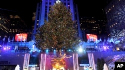 The Rockefeller Center Christmas Tree stands lit, Wednesday, Nov. 29, 2017, in New York. The 75-foot tall Norway spruce is covered with more than 50,000 multi-colored LED lights and will remain lit until Jan. 7. (Diane Bondareff/AP Images)