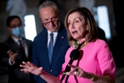 House Speaker Nancy Pelosi, accompanied by Senate Minority Leader Sen. Chuck Schumer, left, speak to reporters following a meeting with Treasury Secretary Steven Mnuchin and White House Chief of Staff Mark Meadows, Aug. 7, 2020.